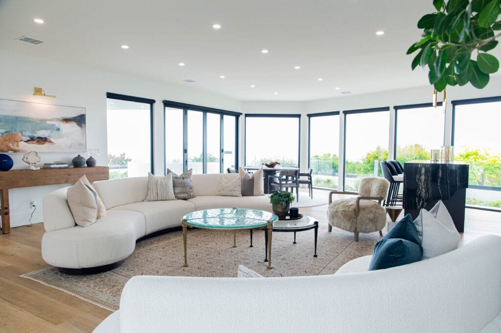 Coastal living room renovation in Corona del Mar, highlighting a bright and open building design.