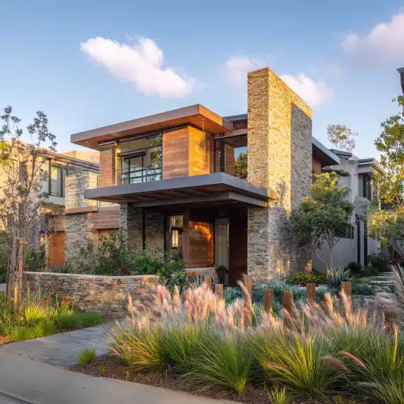 A contemporary ADU with warm wood siding and oversized windows, designed by custom ADU builders in Ladera Ranch.
