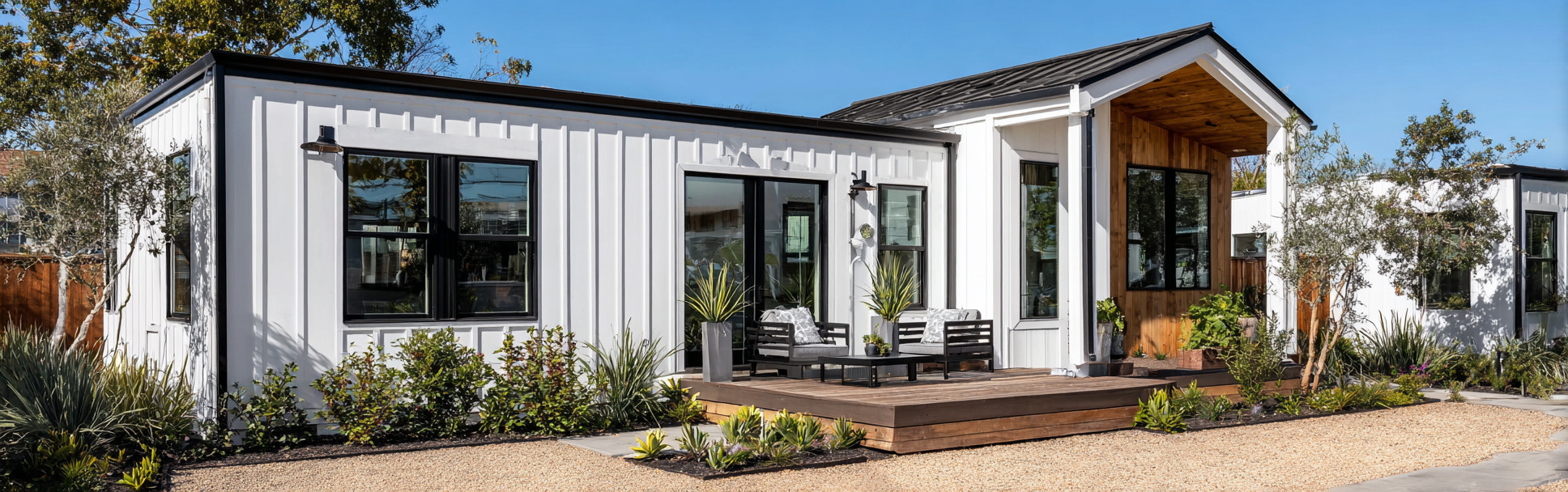 Exterior of a white modern farmhouse ADU in Costa Mesa with black-framed windows