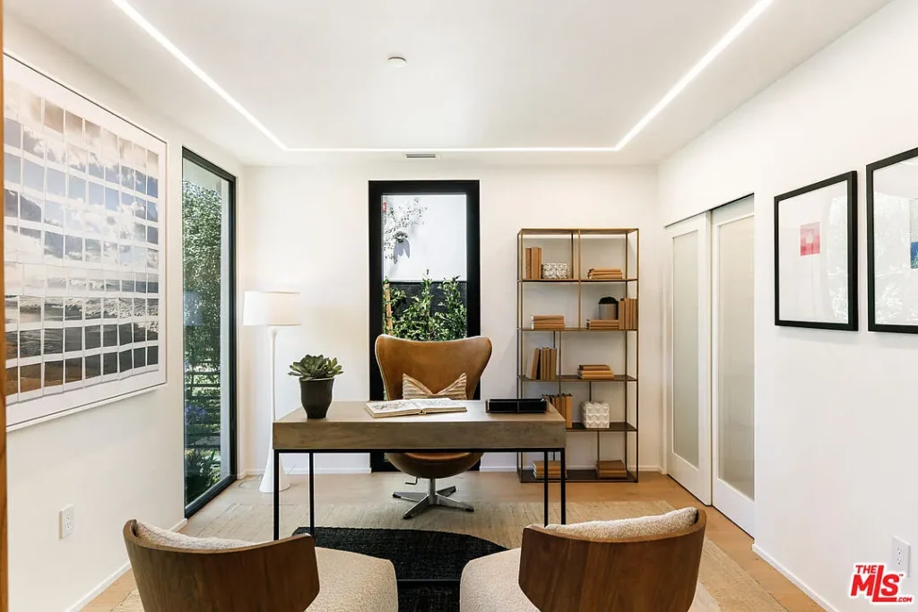 Modern home office interior at 2202 California Ave in Santa Monica featuring a minimalist desk, designer chair, built-in shelving and contemporary decor