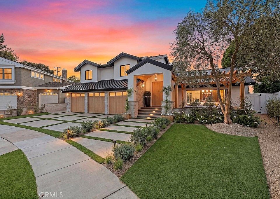 Modern luxury home at 1700 Port Ashley Pl in Newport Beach, California with landscaped front yard