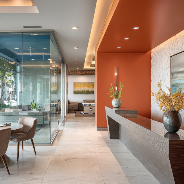 Luxury wellness, physical therapy and chiropractic clinic interior design in California featuring a modern reception, patient waiting lounge, rehabilitation equipment and professional treatment areas.